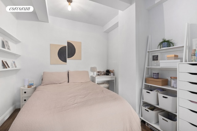 bedroom featuring baseboards, visible vents, and dark wood-style floors