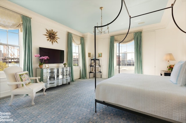 bedroom featuring multiple windows, ornamental molding, and carpet flooring