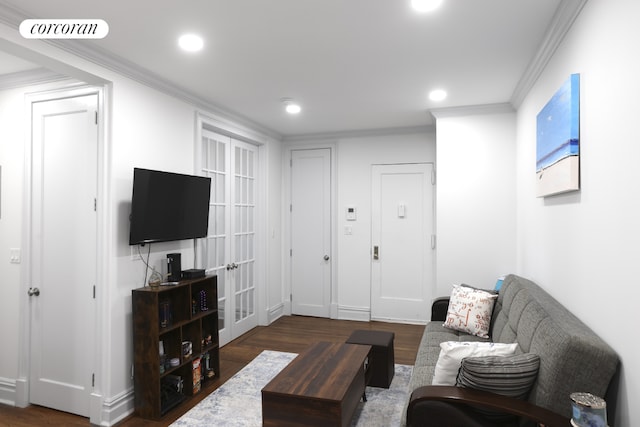 living room with dark hardwood / wood-style flooring, crown molding, and french doors