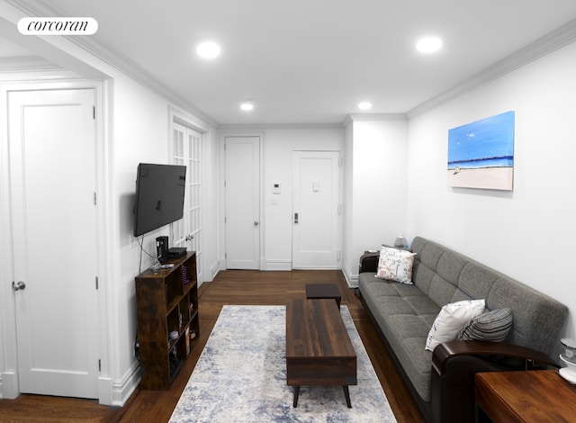 living room featuring ornamental molding and dark hardwood / wood-style flooring