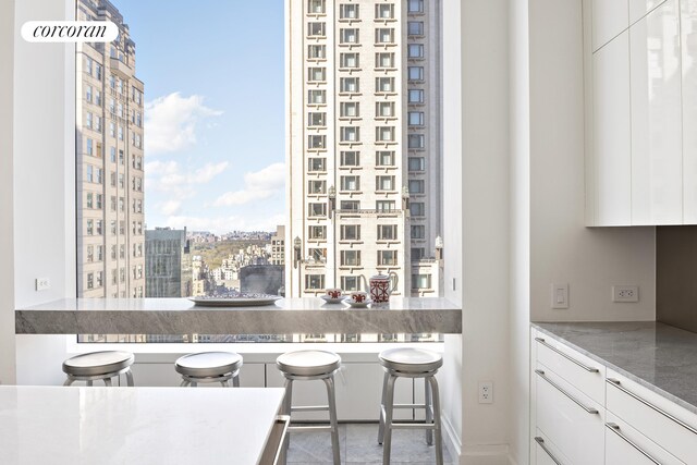 kitchen featuring white cabinetry