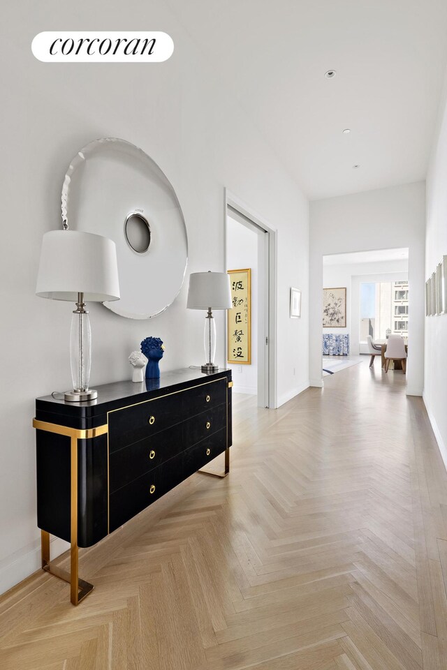 hall featuring light parquet flooring