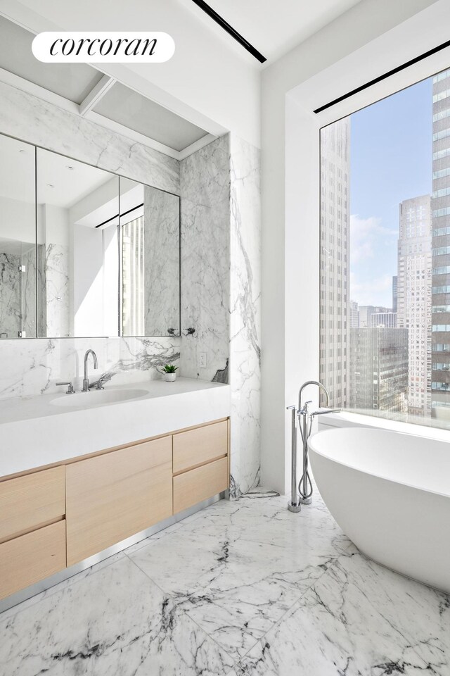 bathroom featuring vanity and a bathtub