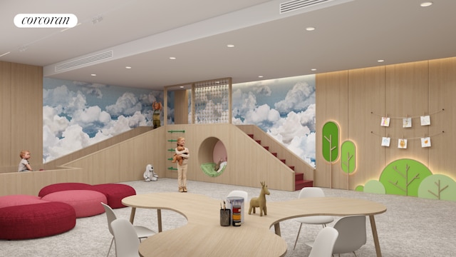 playroom featuring wood walls