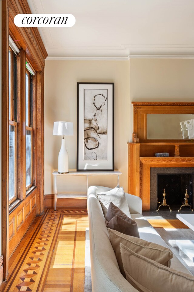 living room featuring ornamental molding and hardwood / wood-style floors