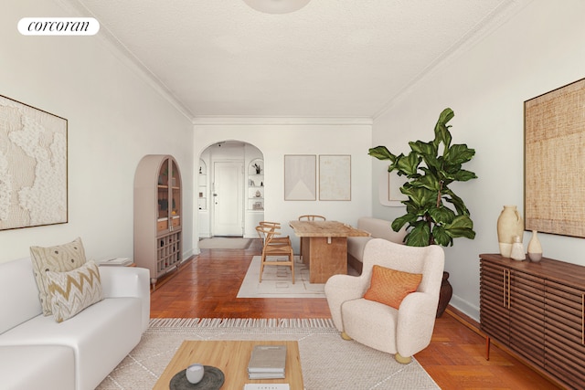 living room featuring ornamental molding and a textured ceiling