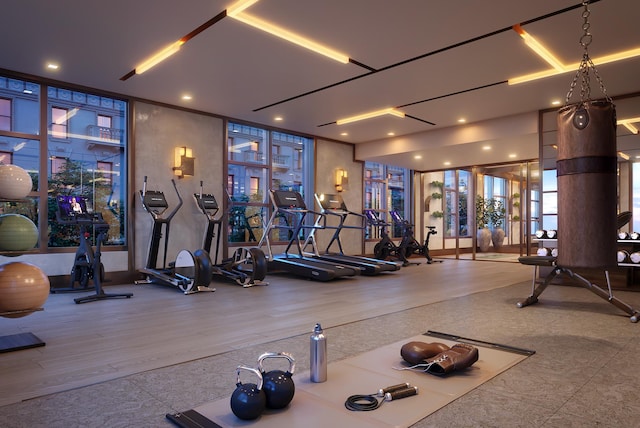 workout area featuring floor to ceiling windows
