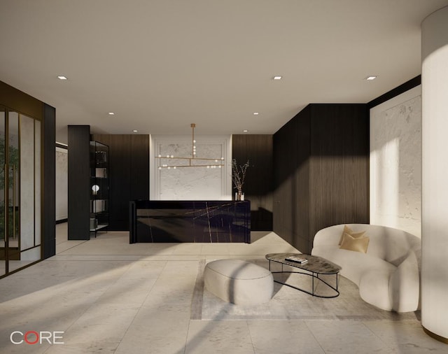 living room featuring a chandelier and light hardwood / wood-style floors