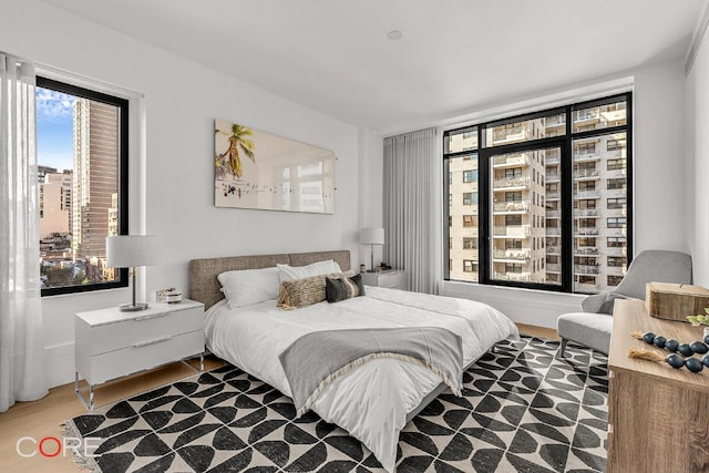 bedroom with hardwood / wood-style floors