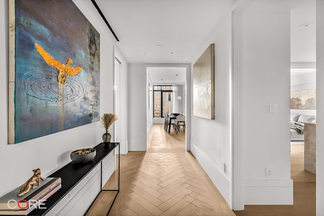 hallway with light parquet flooring