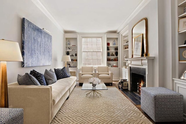 living room featuring crown molding, built in features, and hardwood / wood-style flooring