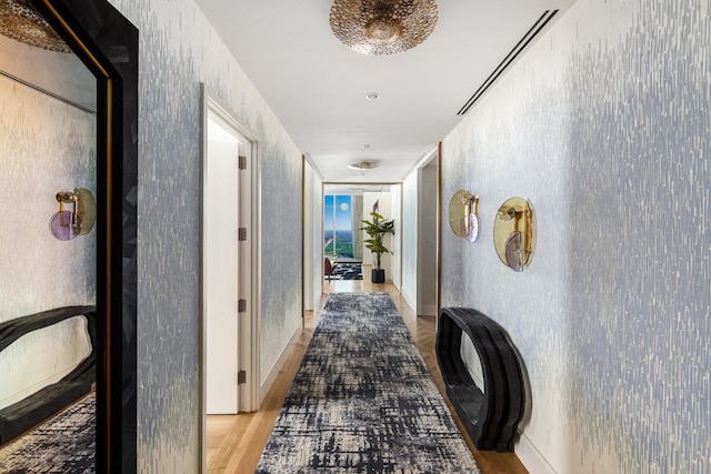 corridor with light wood-type flooring