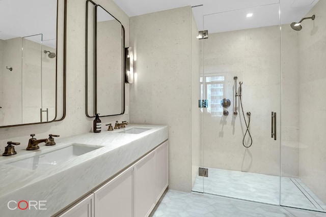 bathroom featuring walk in shower and vanity