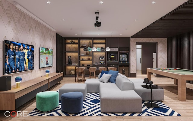 game room featuring light hardwood / wood-style flooring, built in shelves, ornamental molding, and billiards