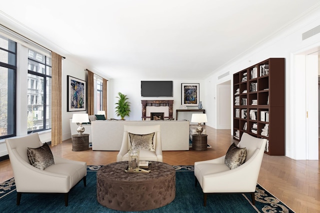 living room featuring crown molding and a fireplace