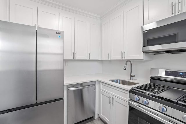 kitchen with white cabinetry, sink, and appliances with stainless steel finishes