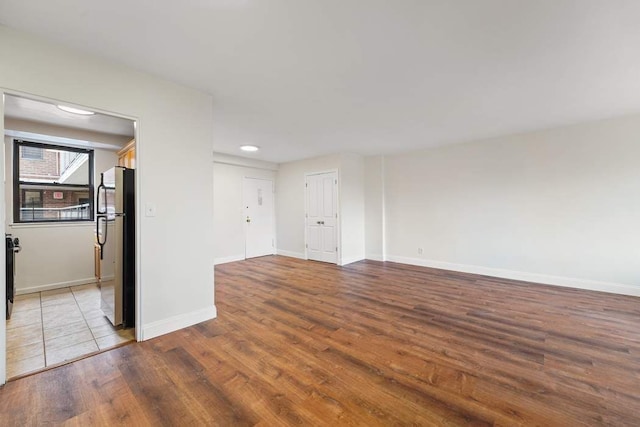 spare room with light wood-type flooring