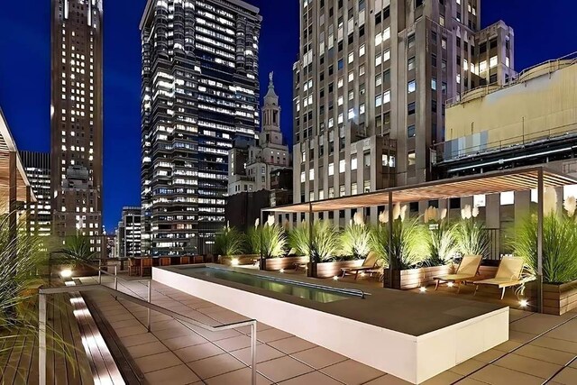20 Pine St Unit 3001, New York City, NY 10005 - surrounding community with a view of city lights
