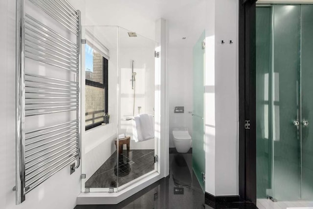 20 Pine St Unit 3001, New York City, NY 10005 - bathroom with radiator, a stall shower, toilet, a towel warming rack, and baseboards