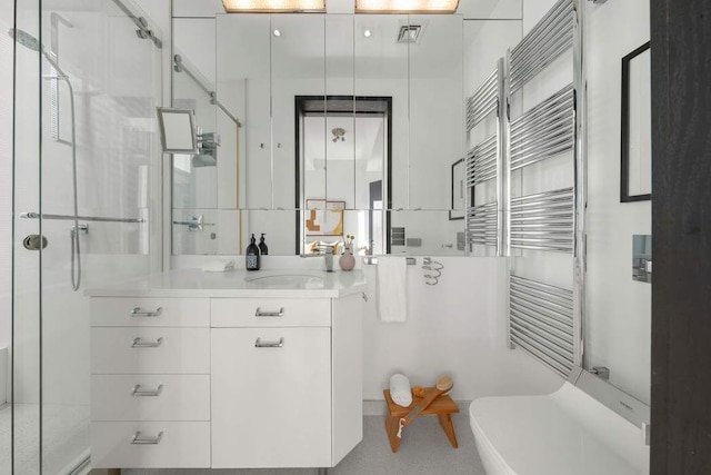 20 Pine St Unit 3001, New York City, NY 10005 - bathroom with a shower stall, radiator heating unit, a towel warming rack, and vanity