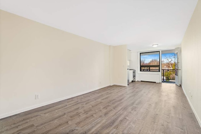 unfurnished living room featuring light wood-type flooring