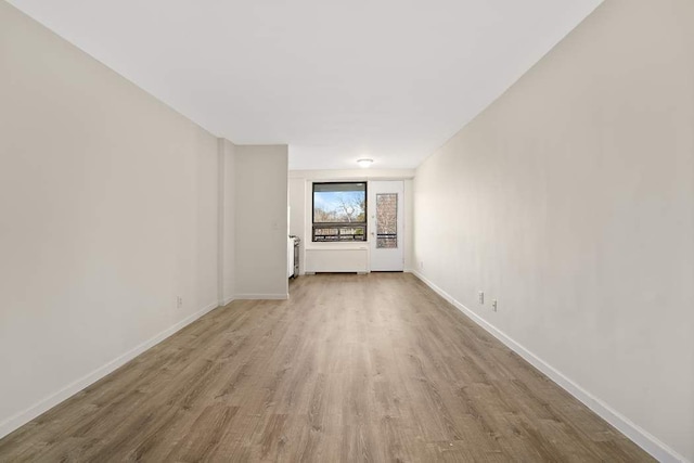 unfurnished living room featuring light wood-type flooring