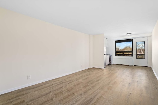 unfurnished living room with light hardwood / wood-style floors