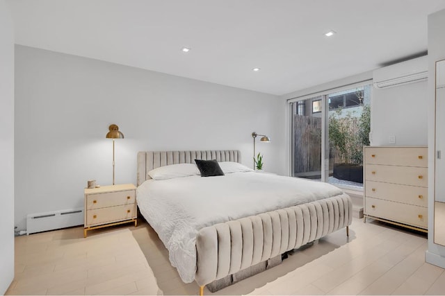 bedroom featuring light wood-type flooring, access to outside, an AC wall unit, and baseboard heating