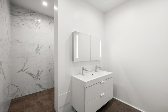 57 W 58th St Unit 6Ab, New York City, NY 10019 - bathroom with vanity, a marble finish shower, and recessed lighting