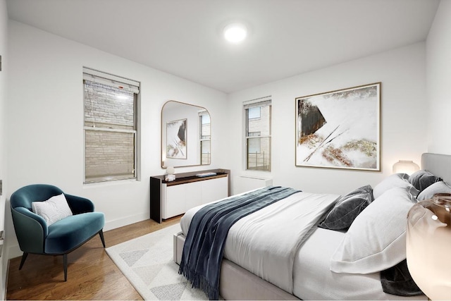 bedroom with light hardwood / wood-style floors