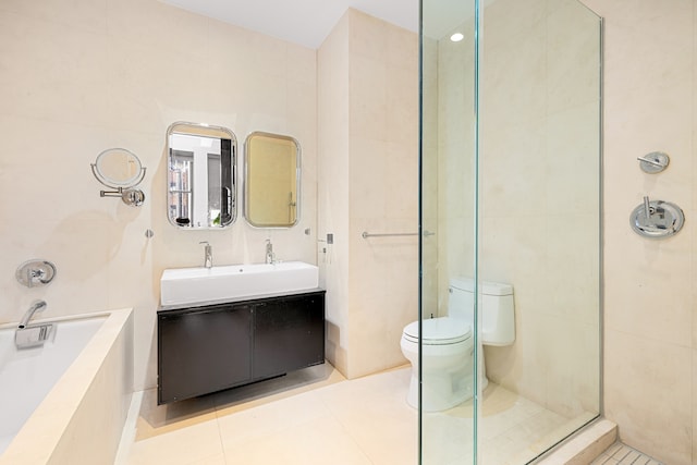 bathroom featuring toilet, tile walls, and tile patterned floors