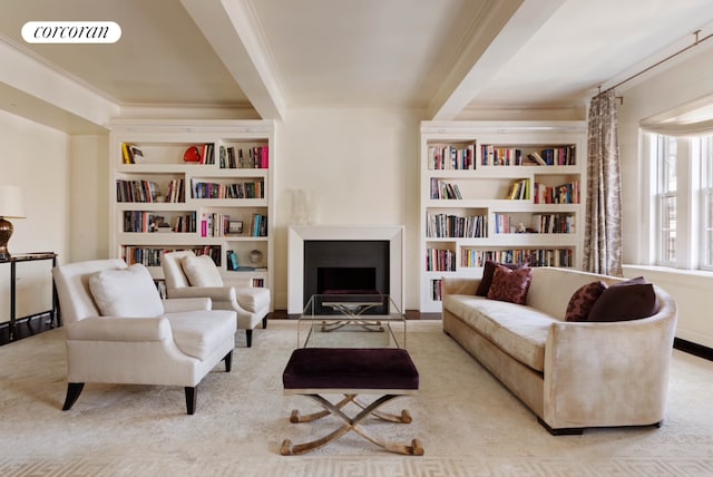 sitting room featuring built in shelves, a fireplace, visible vents, and crown molding