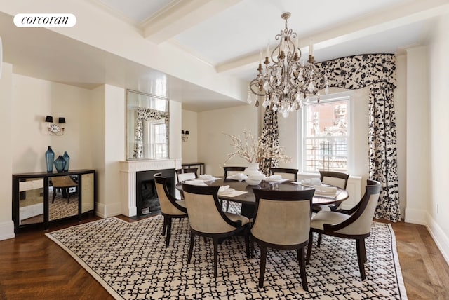 dining space with a fireplace, visible vents, baseboards, beamed ceiling, and an inviting chandelier