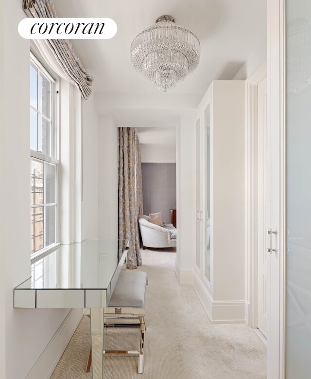 dining area with a notable chandelier, beam ceiling, and dark parquet floors