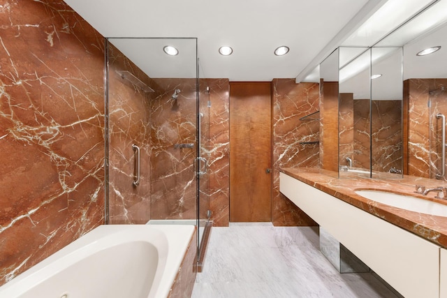 bathroom featuring recessed lighting, marble finish floor, walk in shower, and a bath