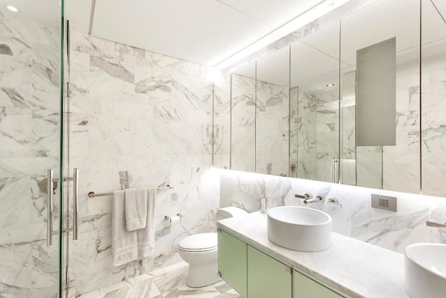 bathroom featuring vanity, tile walls, an enclosed shower, and toilet