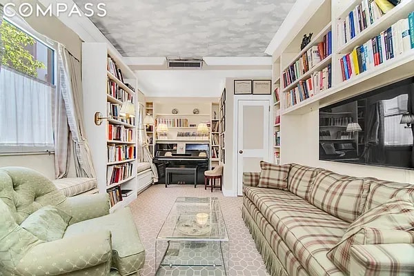 living area with light colored carpet