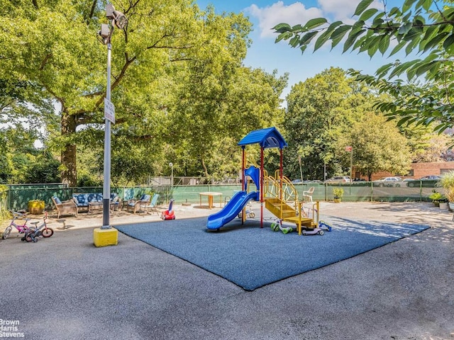 3901 Independence Ave Unit 2T, New York City, NY 10463 - community jungle gym with fence and view of wooded area