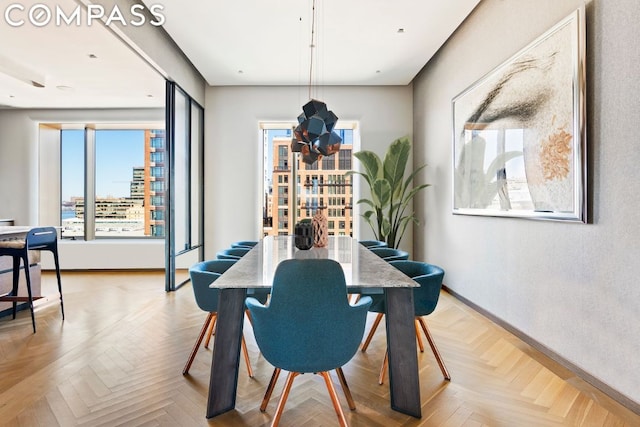 dining room featuring light parquet flooring