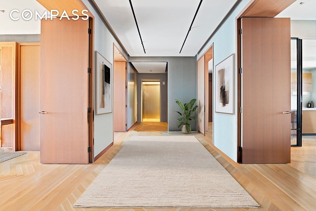 hallway with light wood finished floors