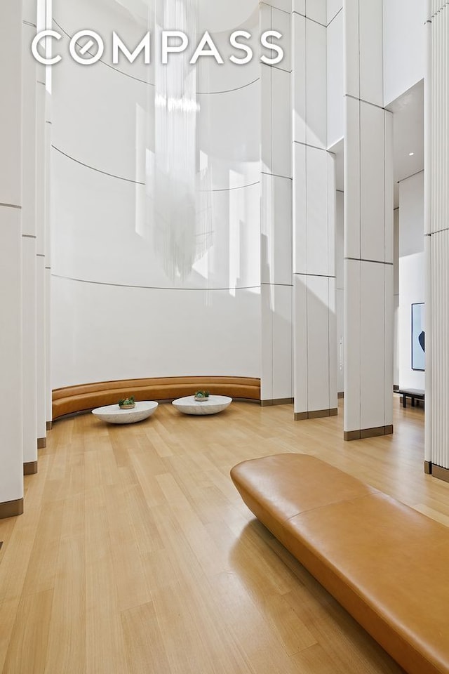 551 W 21st St Unit 10B, New York City, NY 10011 - exercise area with light wood-style floors and baseboards