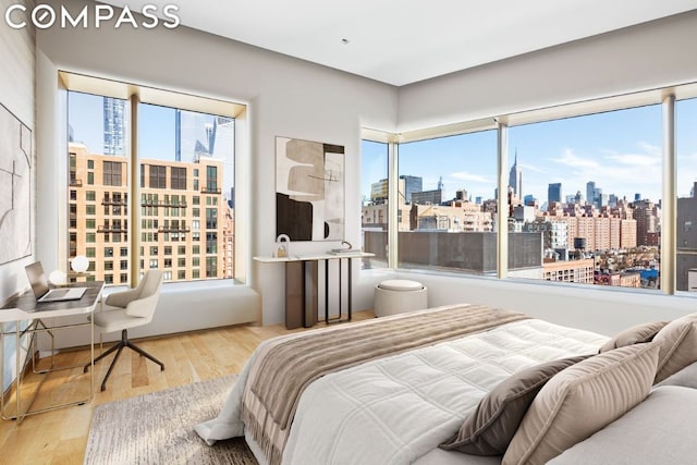 bedroom with hardwood / wood-style floors