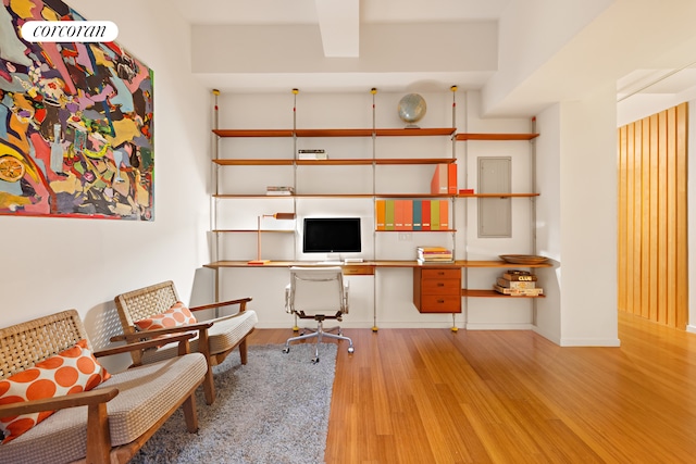 office space featuring baseboards and wood finished floors