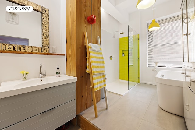 full bathroom with vanity, a shower stall, a soaking tub, and tile patterned floors