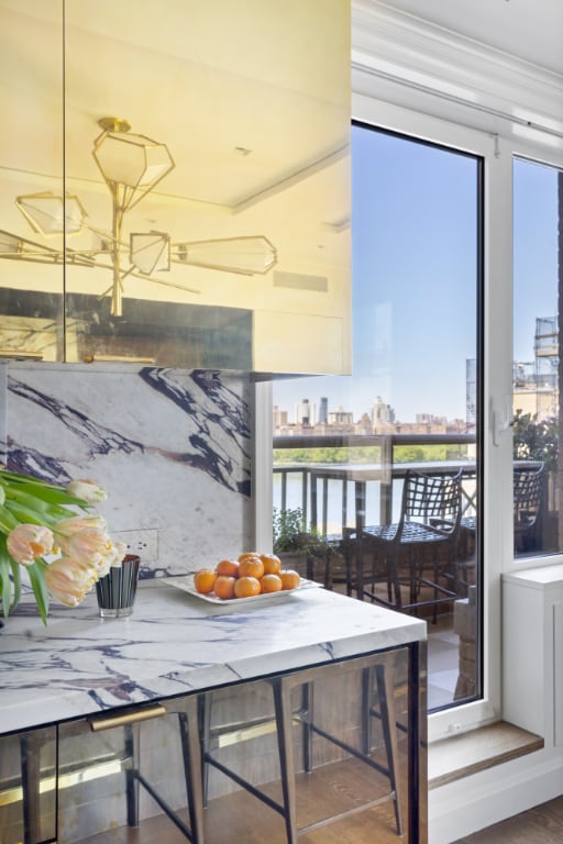 dining room with a view of city and a water view