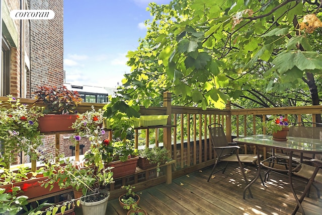 wooden deck with outdoor dining space