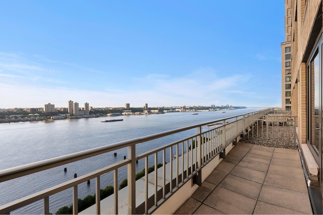 balcony with a city view and a water view