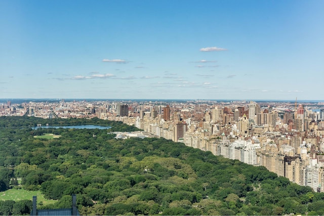 birds eye view of property with a city view, a forest view, and a water view