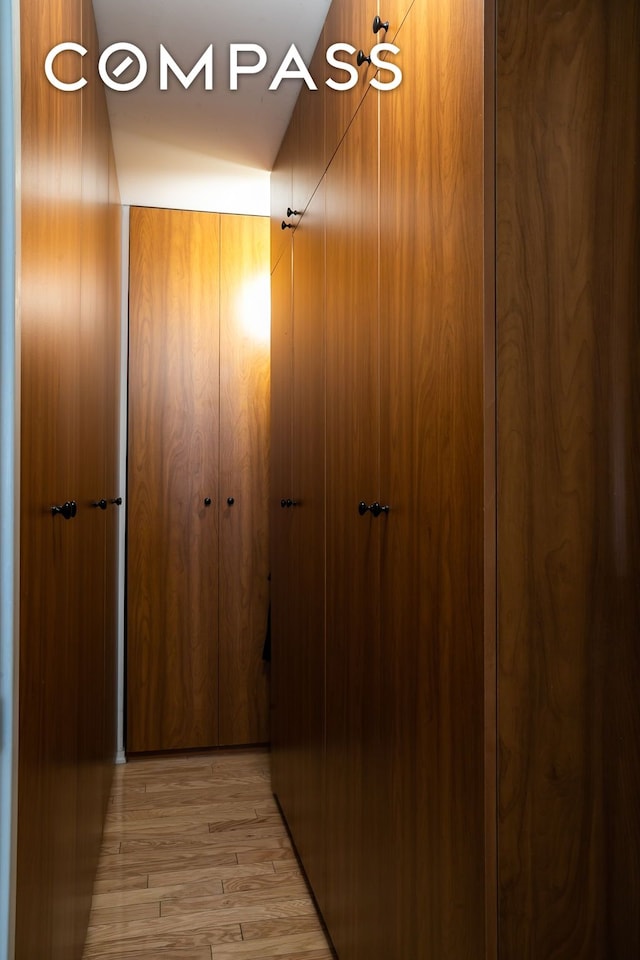 hallway with light wood finished floors