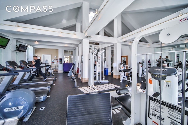 workout area featuring vaulted ceiling